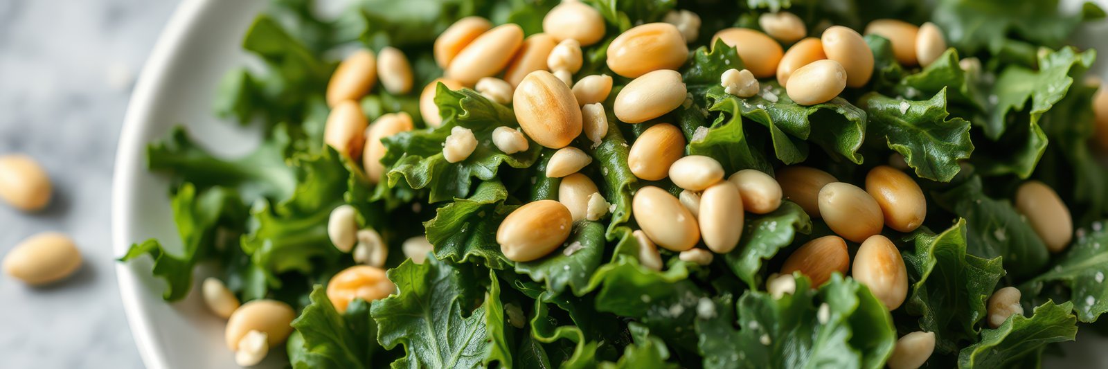 Fresh kale and pine nut salad served in a bowl for a healthy meal option